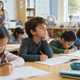 A young child paying attention in a classroom at the start of the school year