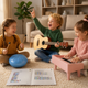 A group of happy young children playing musical instruments together